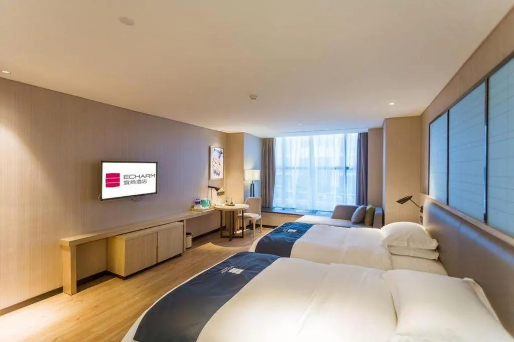 Bed in Echarm Hotel Xiantao Yuantai Weilaicheng