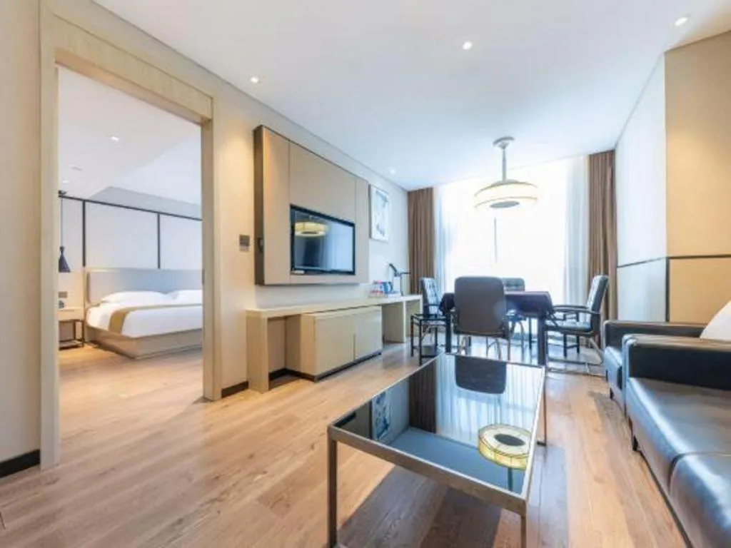 Bed in Echarm Hotel Xiantao Yuantai Weilaicheng