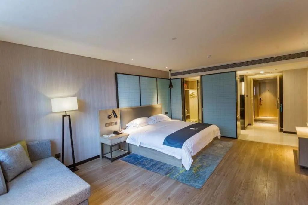 Bed in Echarm Hotel Xiantao Yuantai Weilaicheng