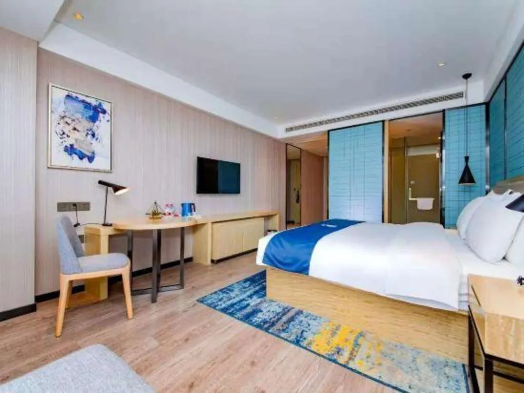 Bed in Echarm Hotel Xiantao Yuantai Weilaicheng