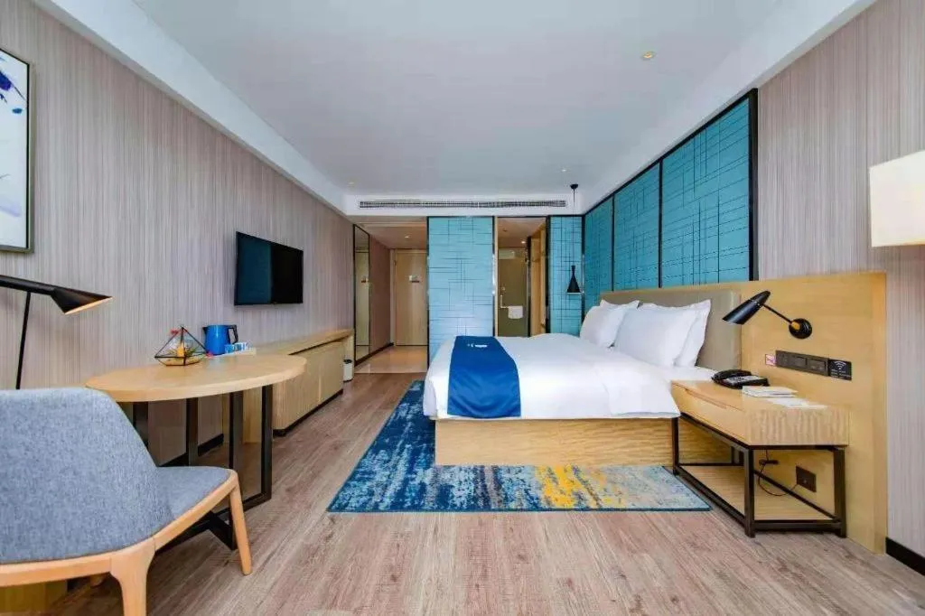 Bed in Echarm Hotel Xiantao Yuantai Weilaicheng