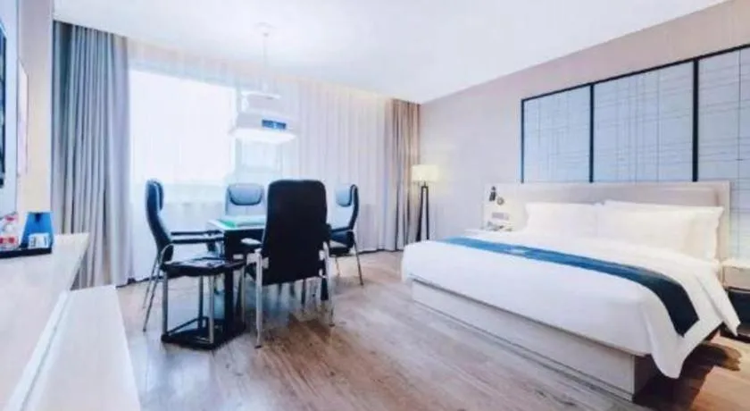 Bed in Echarm Hotel Xiantao Yuantai Weilaicheng