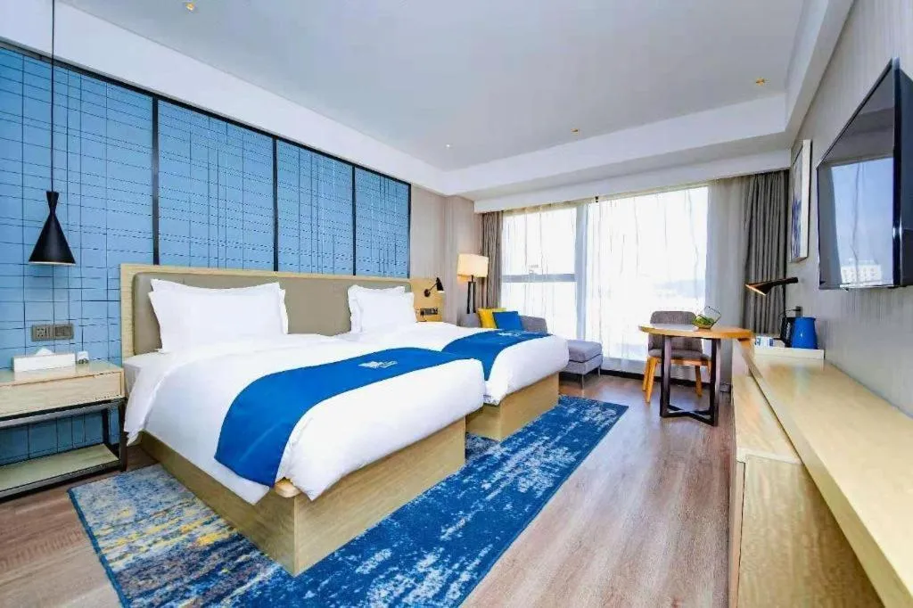 Bed in Echarm Hotel Xiantao Yuantai Weilaicheng