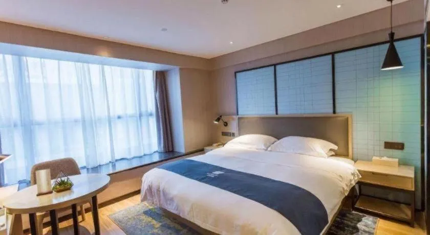 Bed in Echarm Hotel Xiantao Yuantai Weilaicheng