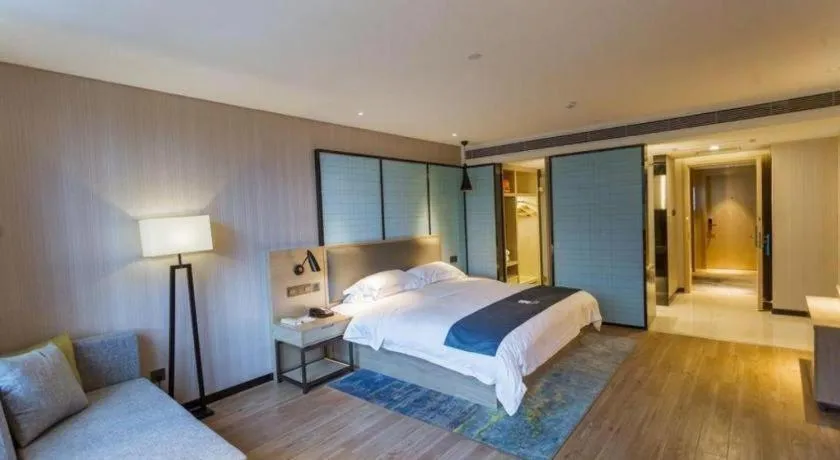 Bed in Echarm Hotel Xiantao Yuantai Weilaicheng