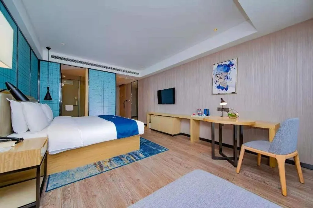 Bed in Echarm Hotel Xiantao Yuantai Weilaicheng