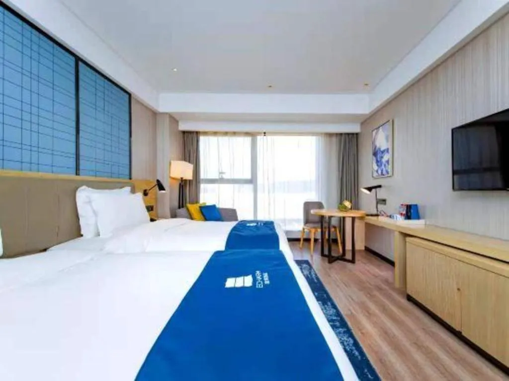 Bed in Echarm Hotel Xiantao Yuantai Weilaicheng