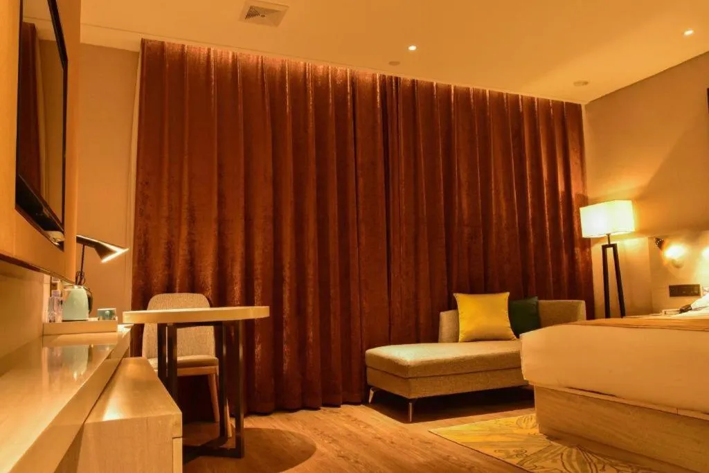 Bed in Echarm Hotel Xiantao Yuantai Weilaicheng