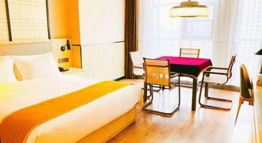 Bed in Echarm Hotel Xiantao Yuantai Weilaicheng