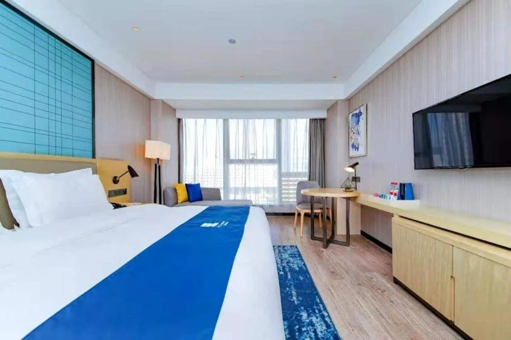 Bed in Echarm Hotel Xiantao Yuantai Weilaicheng