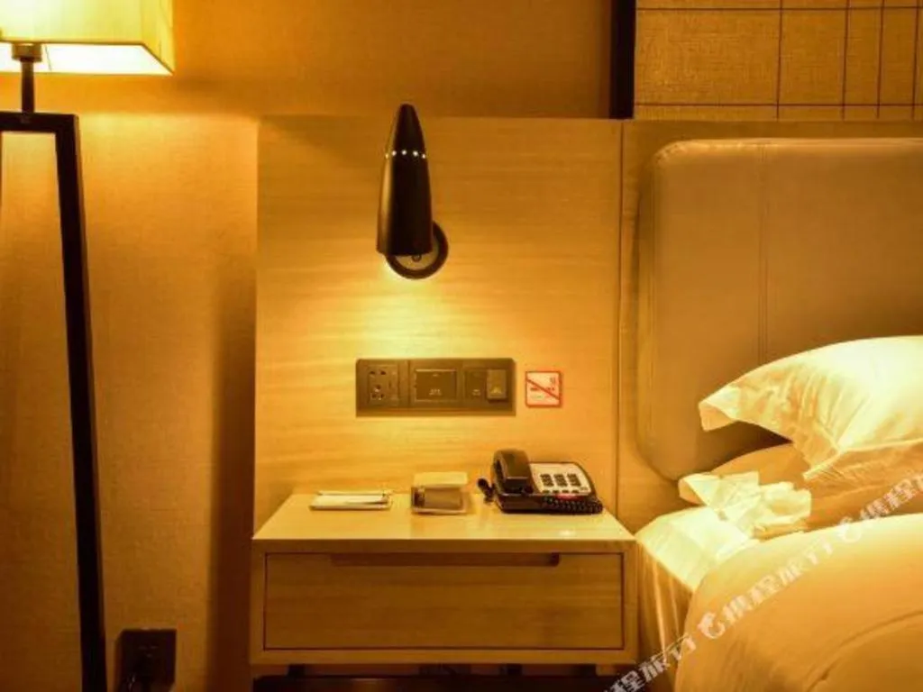 Bed in Echarm Hotel Xiantao Yuantai Weilaicheng