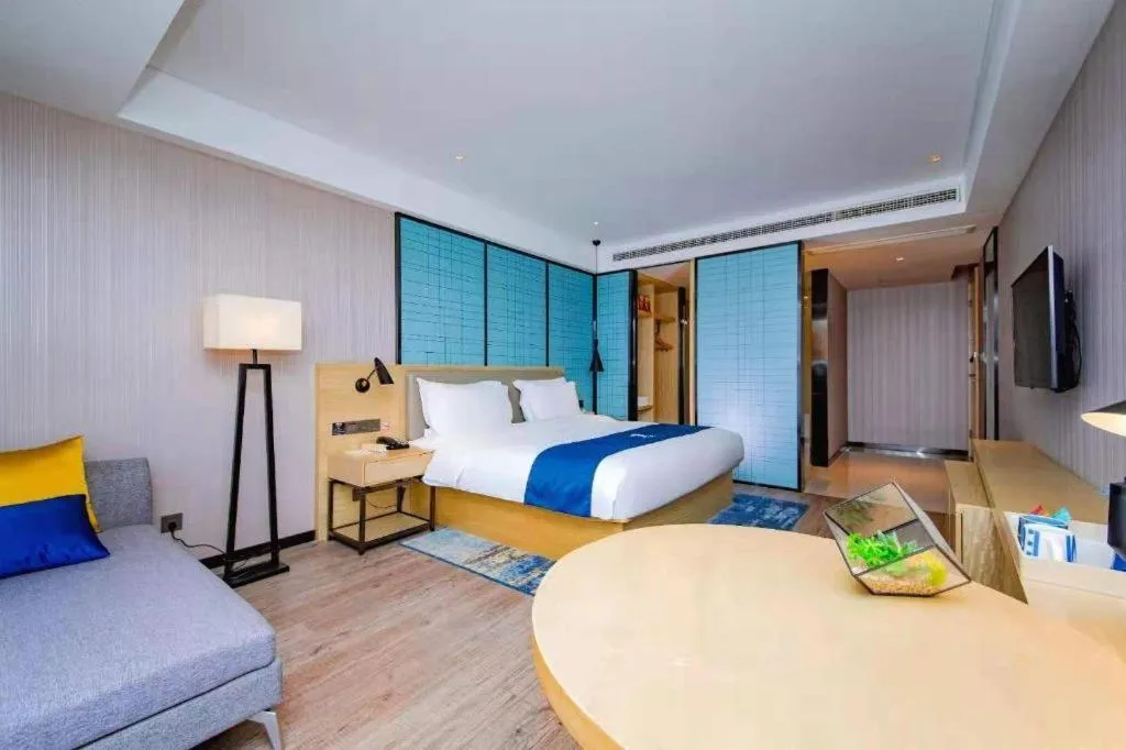 Bed in Echarm Hotel Xiantao Yuantai Weilaicheng