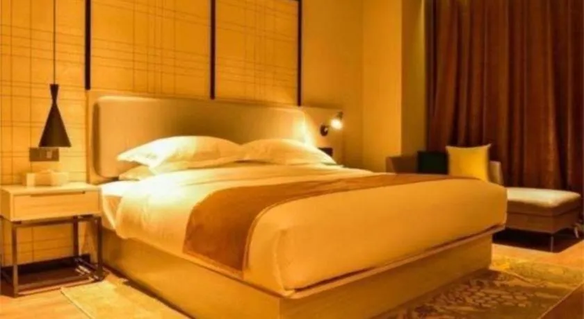 Bed in Echarm Hotel Xiantao Yuantai Weilaicheng