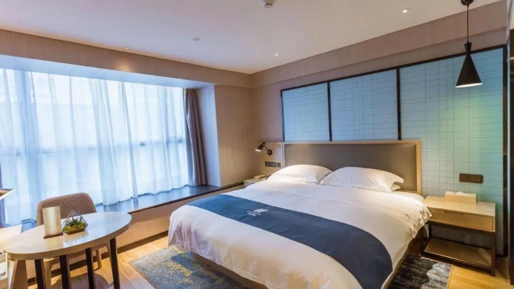 Bed in Echarm Hotel Xiantao Yuantai Weilaicheng