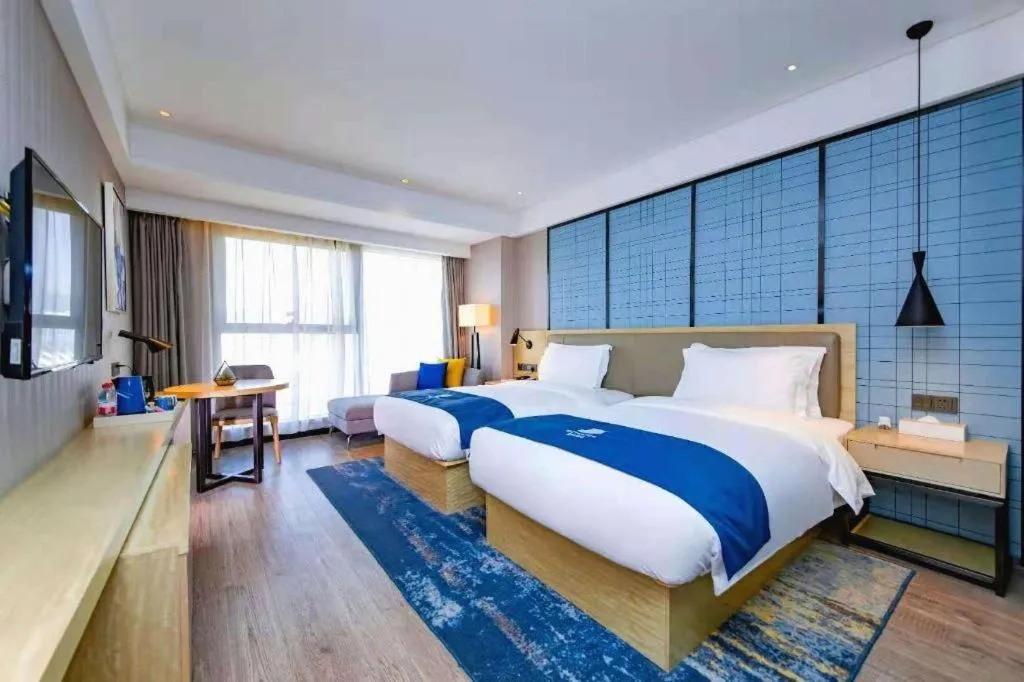 Bed in Echarm Hotel Xiantao Yuantai Weilaicheng