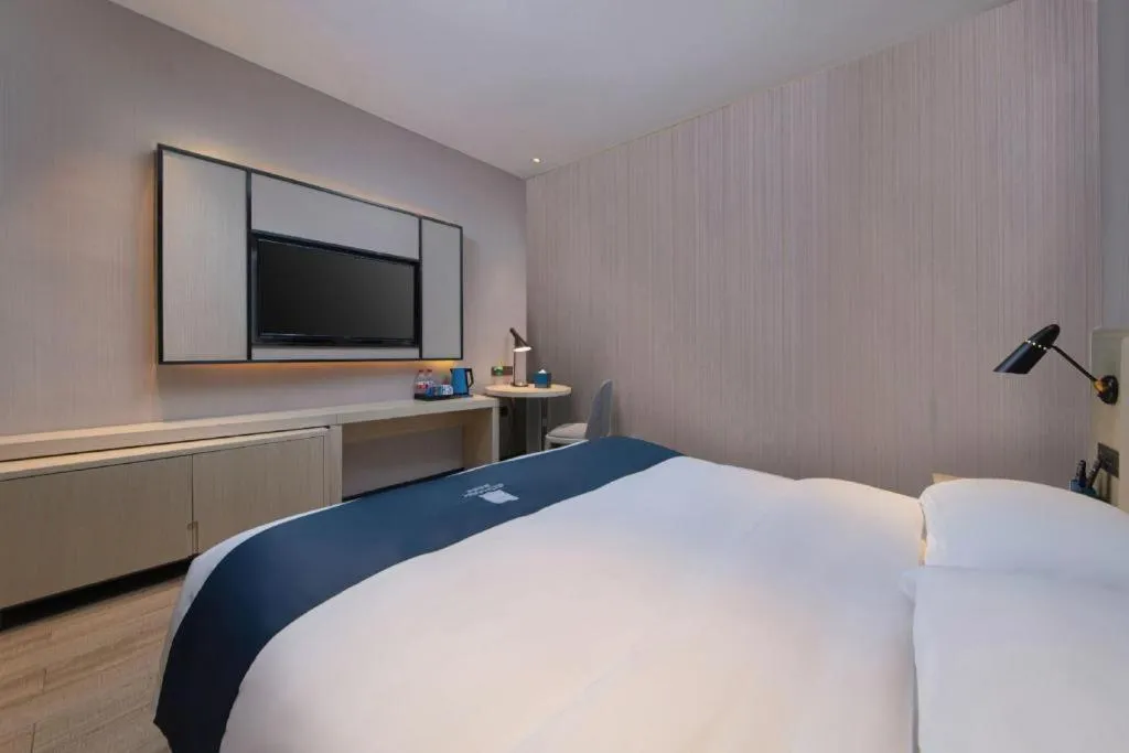 Bed in Echarm Hotel Hefei Binhu Exhibition Center