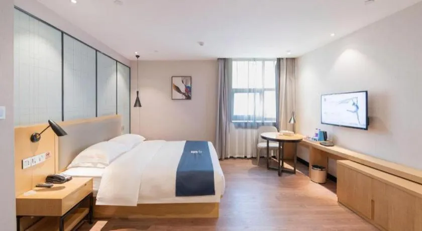 Bed in Echarm Hotel Hefei Binhu Exhibition Center