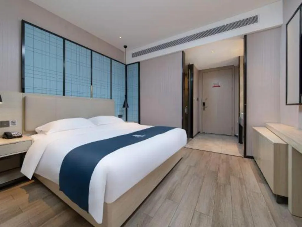 Bed in Echarm Hotel Hefei Binhu Exhibition Center