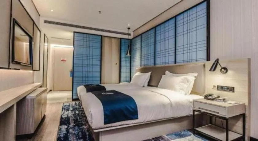 Bed in Echarm Hotel Hefei Binhu Exhibition Center