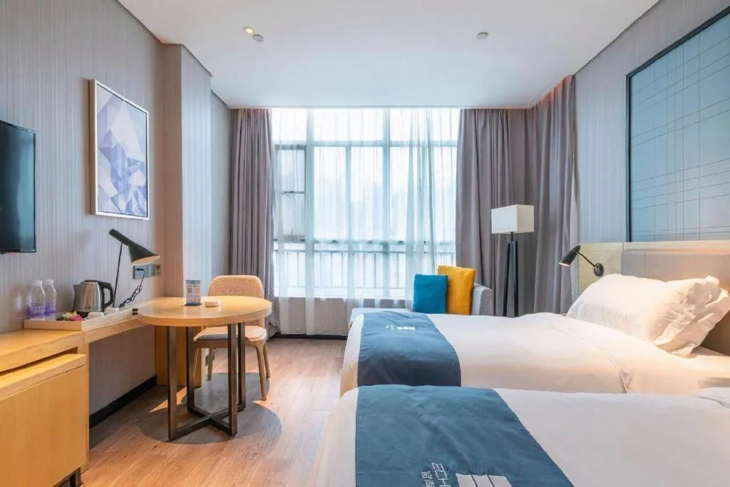 Bed in Echarm Hotel Hefei Binhu Exhibition Center