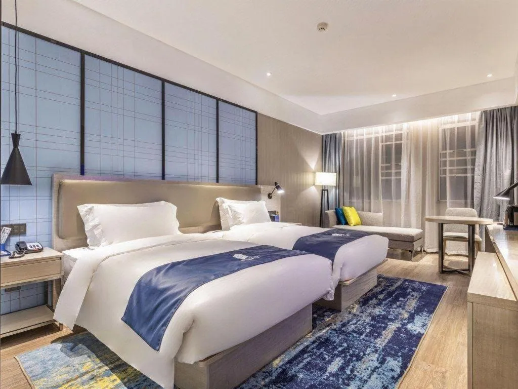 Bed in Echarm Hotel Hefei Binhu Exhibition Center