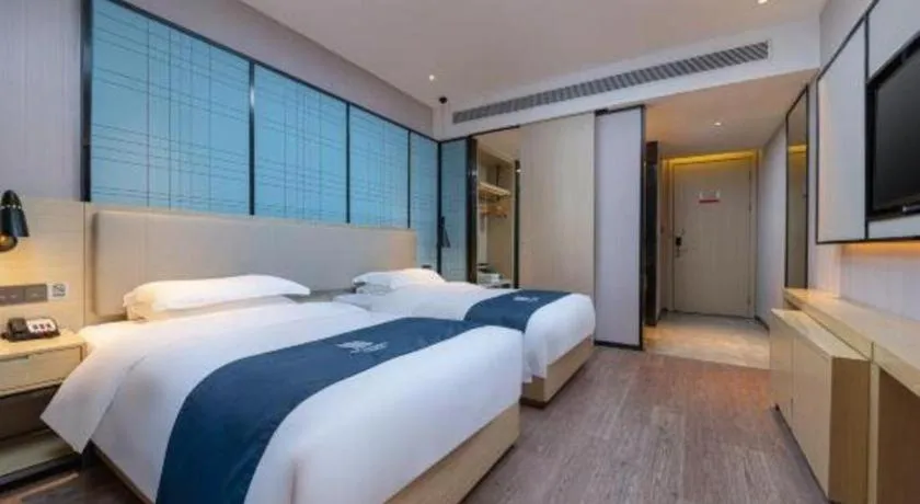 Bed in Echarm Hotel Hefei Binhu Exhibition Center