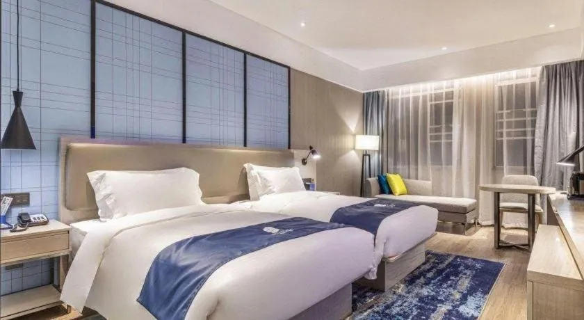 Bed in Echarm Hotel Hefei Binhu Exhibition Center