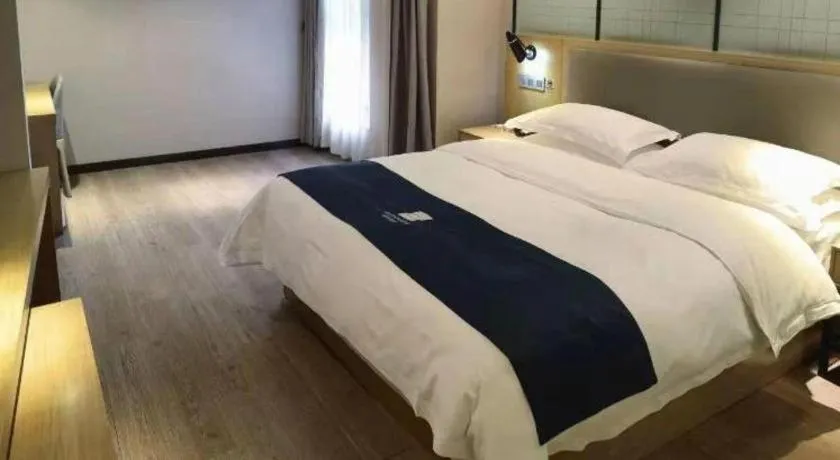 Bed in Echarm Hotel Hefei Binhu Exhibition Center