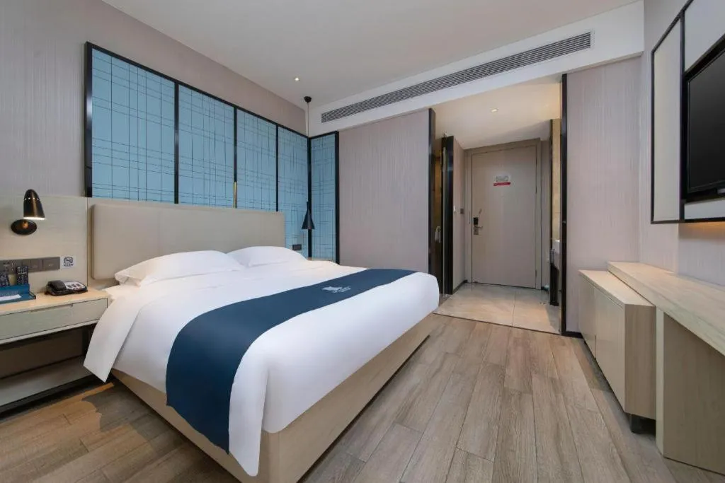Bed in Echarm Hotel Hefei Binhu Exhibition Center