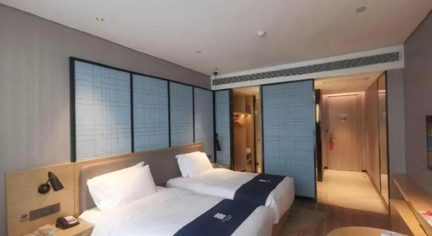Bed in Echarm Hotel Hefei Binhu Exhibition Center