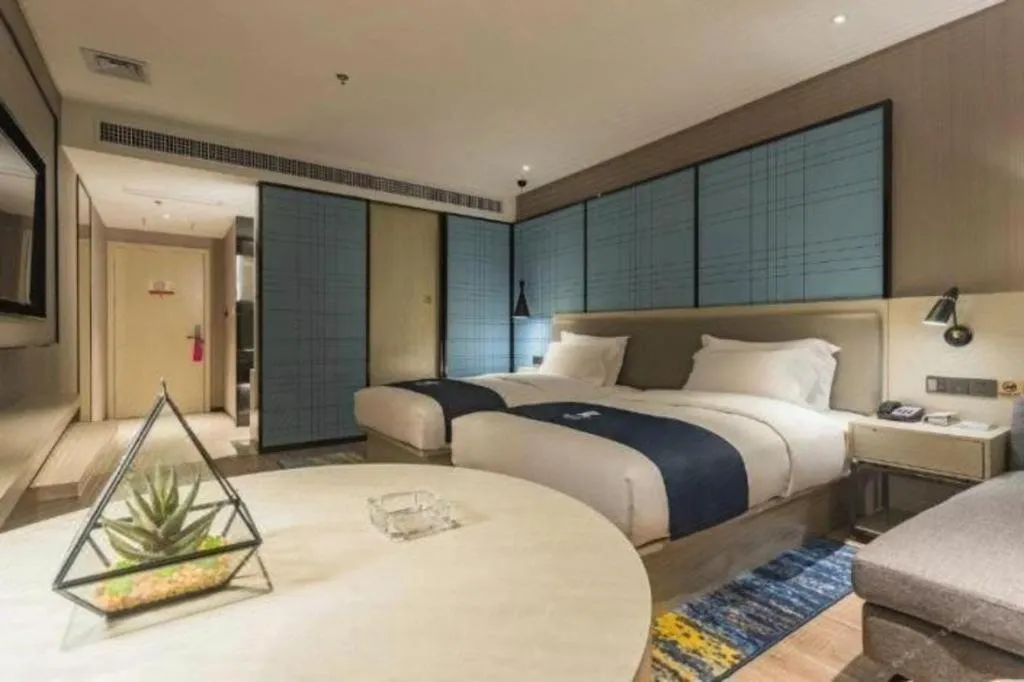 Bed in Echarm Hotel Hefei Binhu Exhibition Center