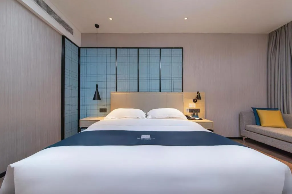 Bed in Echarm Hotel Hefei Binhu Exhibition Center