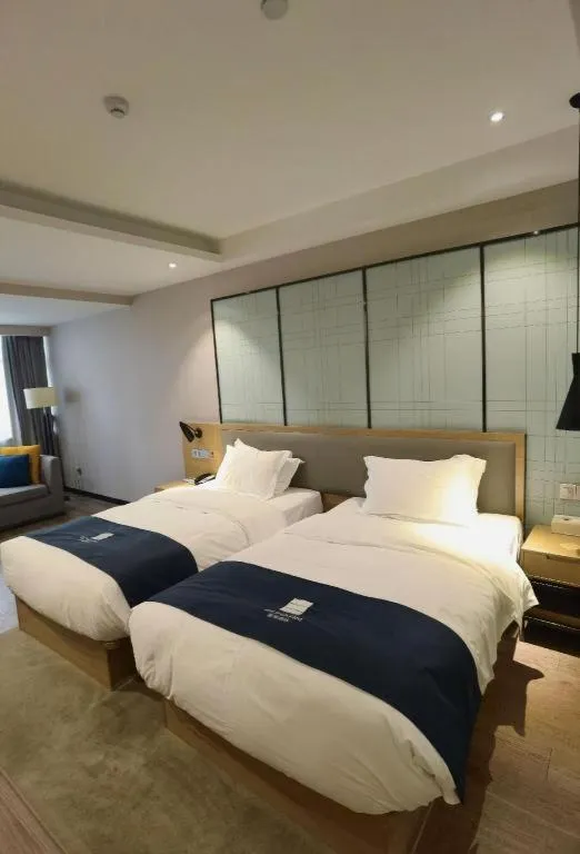 Bed in Echarm Hotel Hefei Binhu Exhibition Center