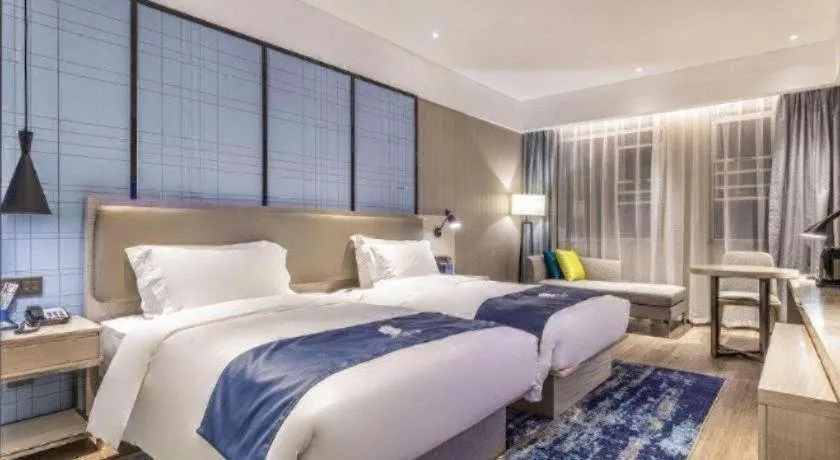 Bed in Echarm Hotel Hefei Binhu Exhibition Center