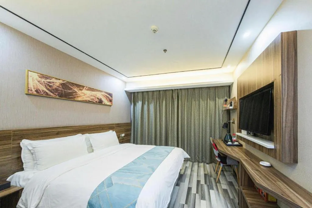 Bed in Borrman Hotel Zhenjiang Dashikou Suning Plaza
