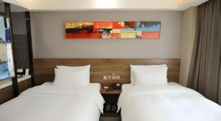 Bed in Borrman Hotel Zhenjiang Dashikou Suning Plaza