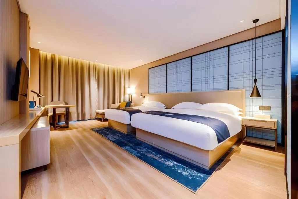 Bed in Echarm Hotel Guizhou Xingyi Jushan Avenue