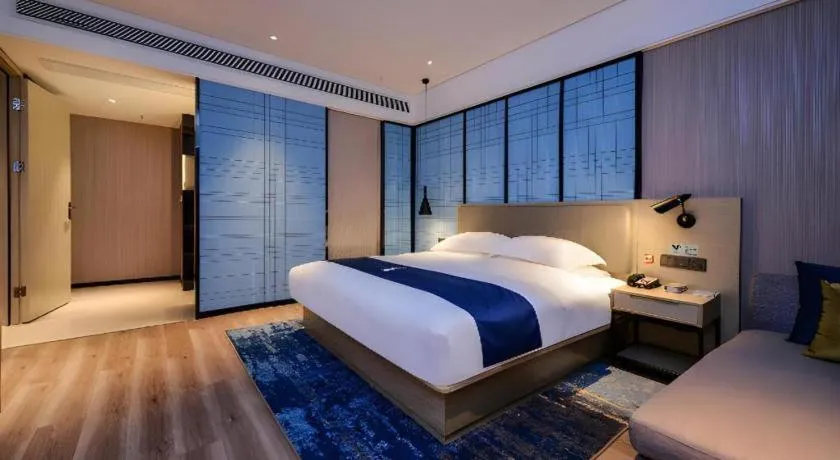 Bed in Echarm Hotel Guizhou Xingyi Jushan Avenue