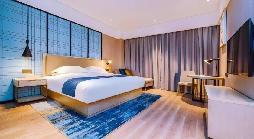 Bed in Echarm Hotel Guizhou Xingyi Jushan Avenue