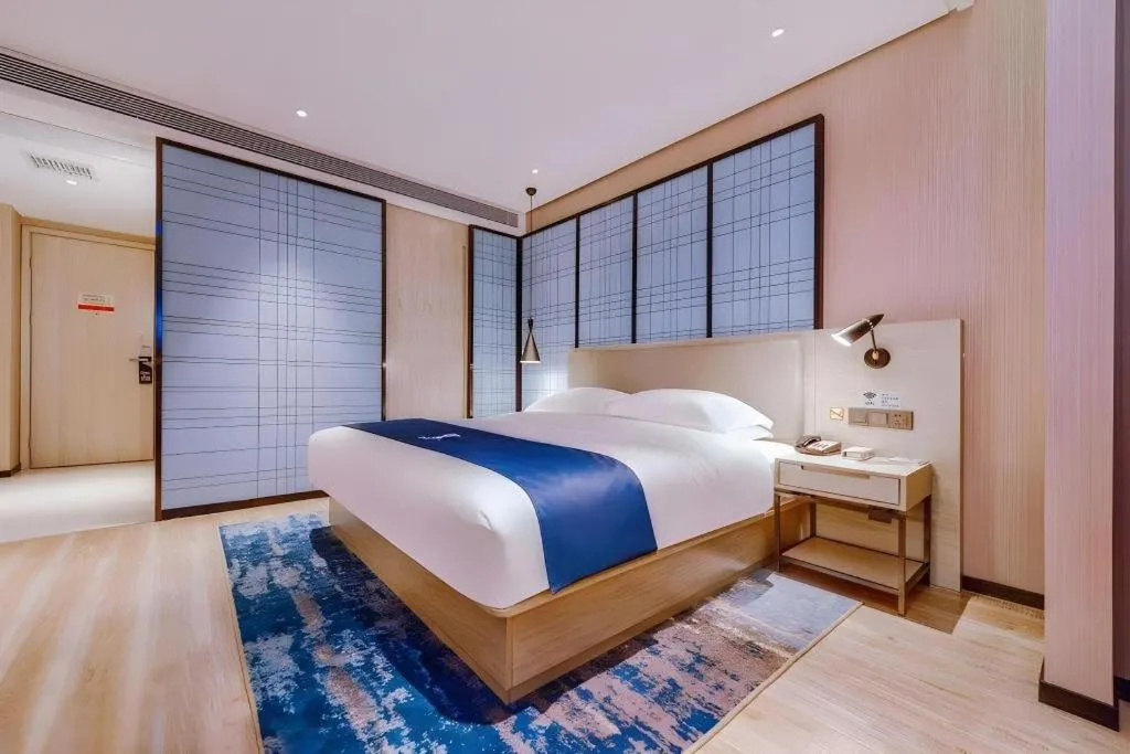 Bed in Echarm Hotel Guizhou Xingyi Jushan Avenue