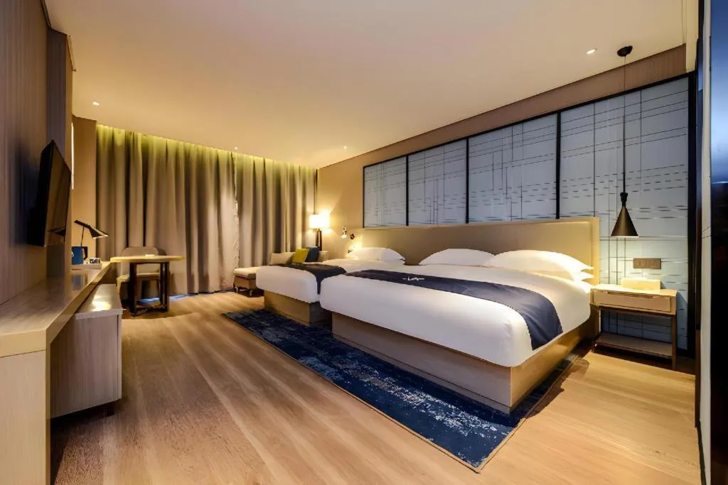 Bed in Echarm Hotel Guizhou Xingyi Jushan Avenue