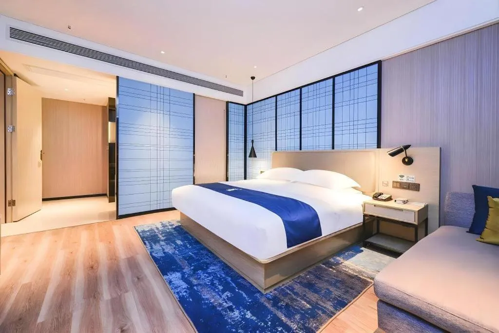 Bed in Echarm Hotel Guizhou Xingyi Jushan Avenue