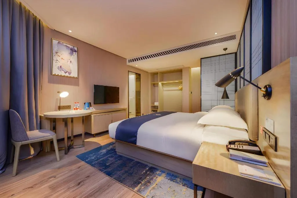 Bed in Echarm Hotel Guizhou Xingyi Jushan Avenue