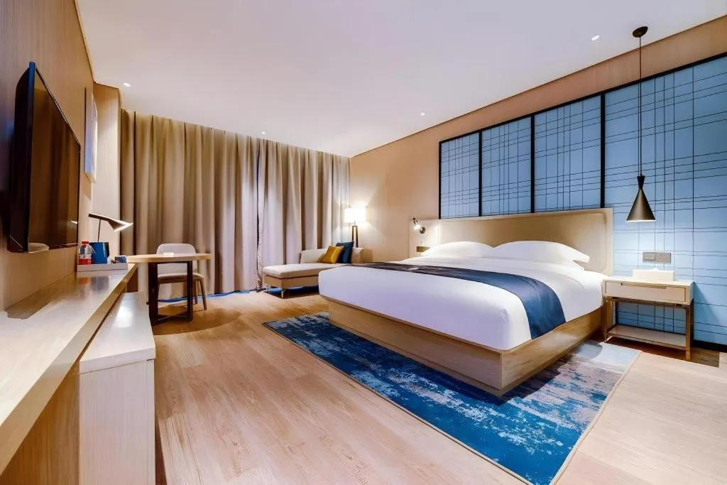 Bed in Echarm Hotel Guizhou Xingyi Jushan Avenue