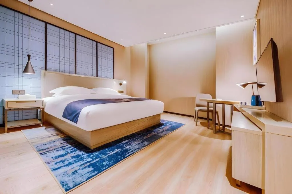 Bed in Echarm Hotel Guizhou Xingyi Jushan Avenue