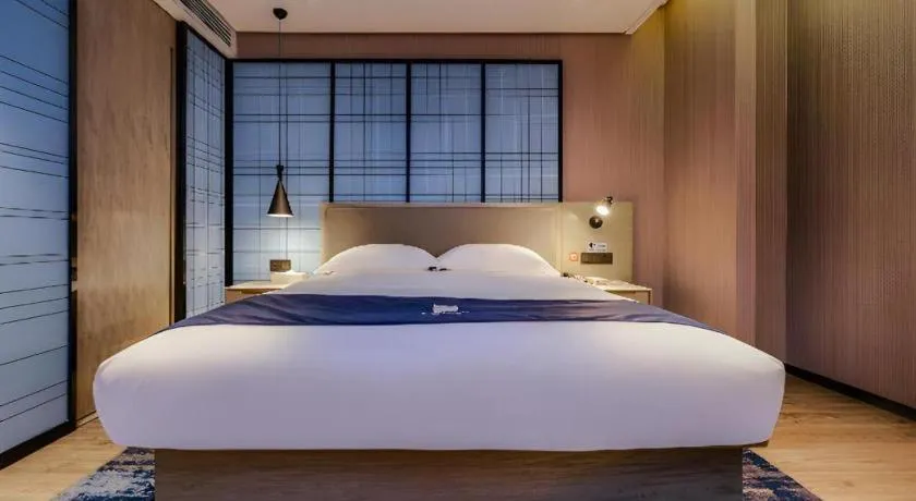 Bed in Echarm Hotel Guizhou Xingyi Jushan Avenue
