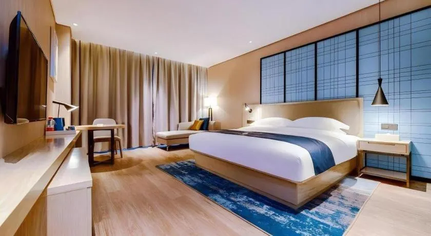 Bed in Echarm Hotel Guizhou Xingyi Jushan Avenue