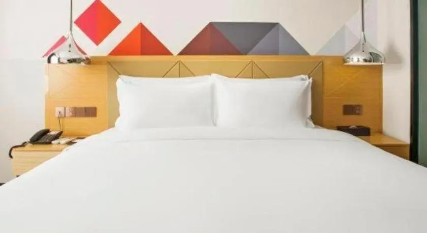 Bed in Borrman Hotel Zhuhai Gongbei Port Fuhuali Light Rail