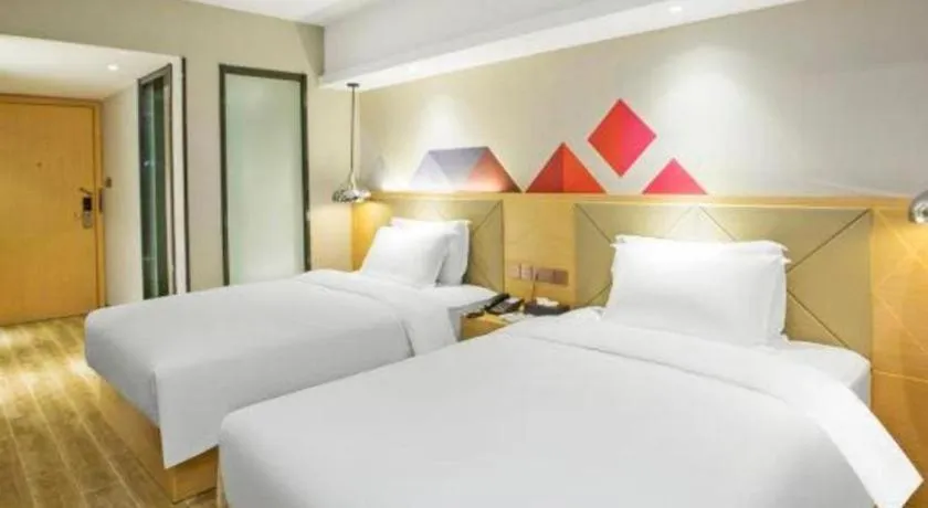 Bed in Borrman Hotel Zhuhai Gongbei Port Fuhuali Light Rail