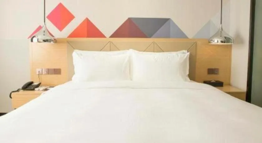 Bed in Borrman Hotel Zhuhai Gongbei Port Fuhuali Light Rail